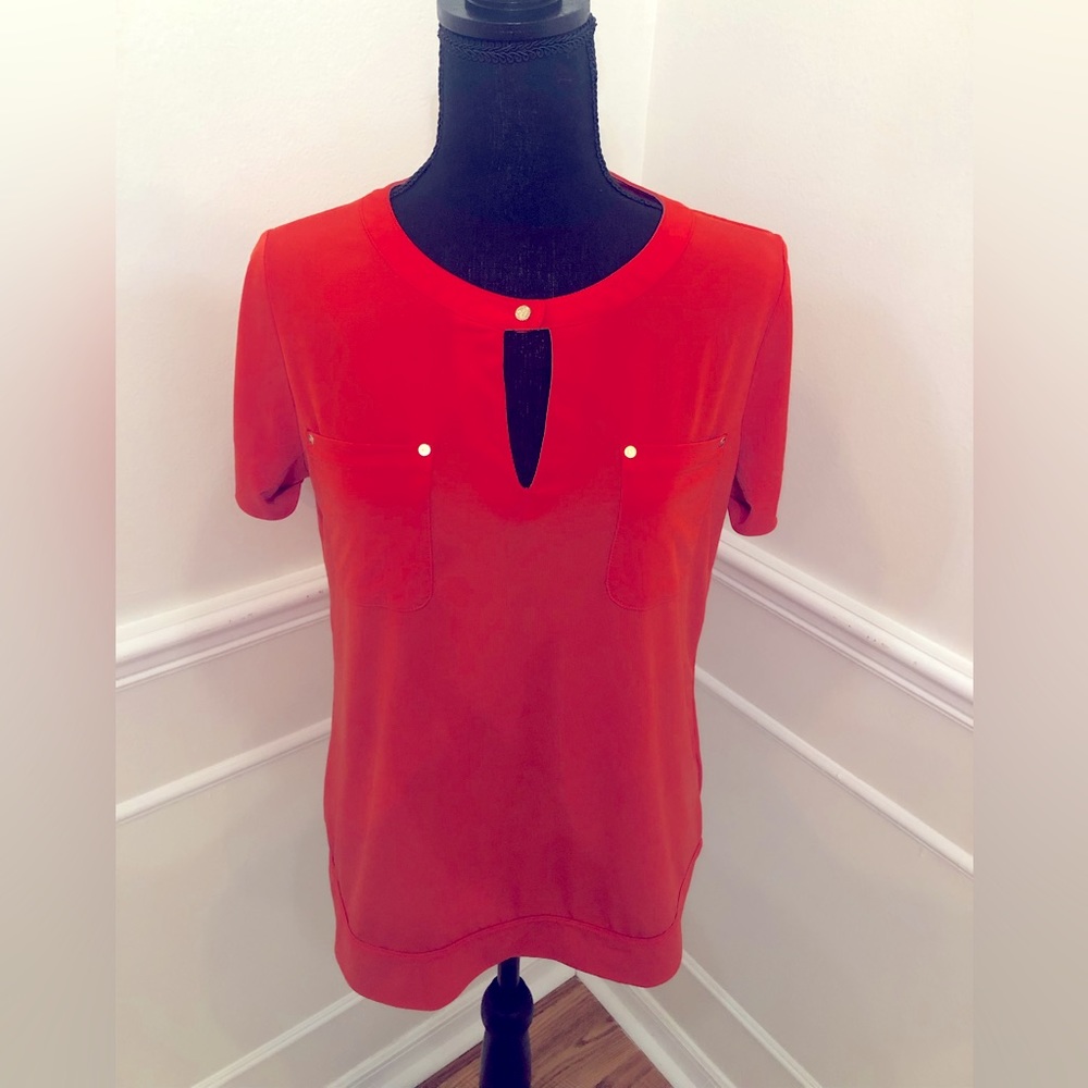 Orange top with gold details. Anne Klein